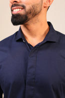 Close-up of navy shirt back and shoulder stitching.