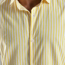 Close-up of a yellow and white striped shirt with a focus on the collar and buttons.