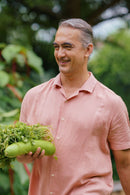 Man smiling in navy blue shirt