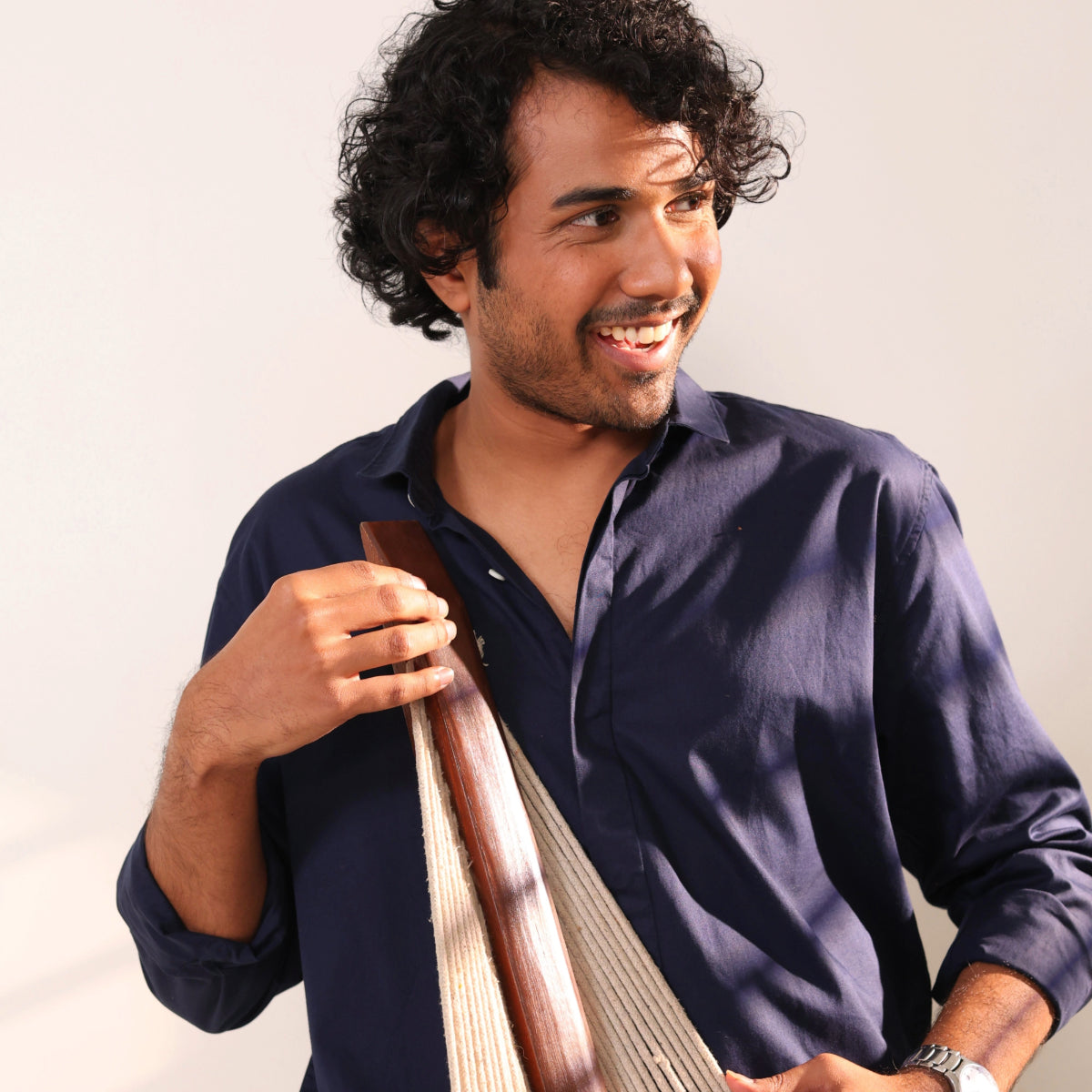 Man holding woven fabric
